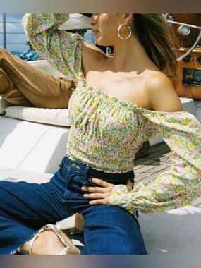 With Jean fonda off shoulder top